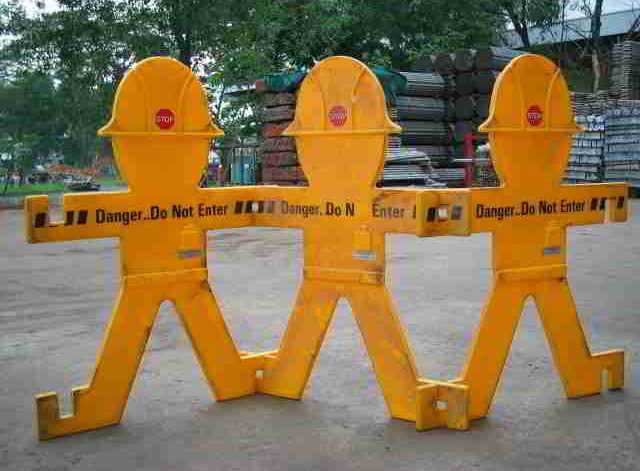Barrier to Social and Learning Success Construction barricade yellow plastic men with hard-hats